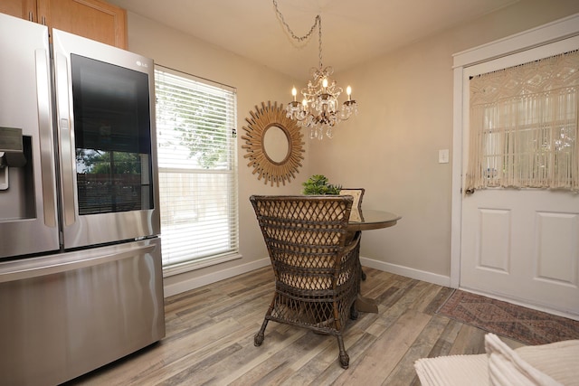 52 NE Iowa Dr, Fort Walton Beach, FL 32548 - dining room with light wood-type flooring and a chandelier