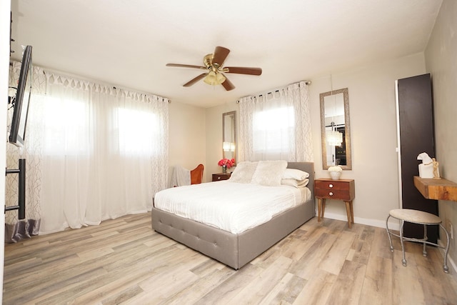 52 NE Iowa Dr, Fort Walton Beach, FL 32548 - bedroom with multiple windows, wood finished floors, and ceiling fan