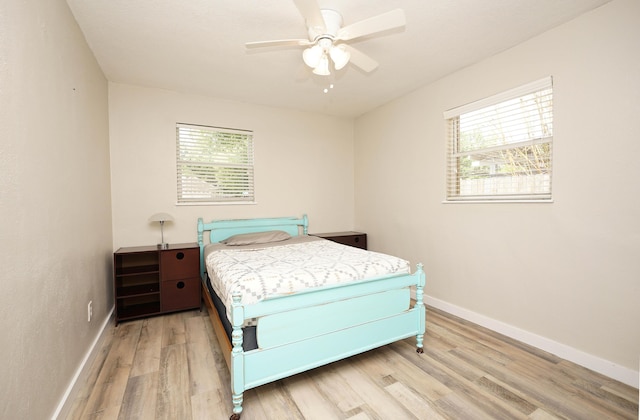 52 NE Iowa Dr, Fort Walton Beach, FL 32548 - bedroom featuring light wood-style flooring and a ceiling fan