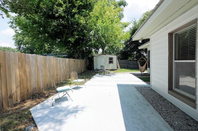 52 NE Iowa Dr, Fort Walton Beach, FL 32548 - fenced backyard featuring a shed and a patio area