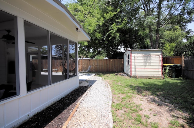 52 NE Iowa Dr, Fort Walton Beach, FL 32548 - fenced backyard featuring a sunroom and a shed