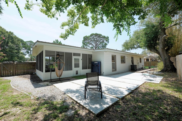 52 NE Iowa Dr, Fort Walton Beach, FL 32548 - back of property featuring a sunroom, a patio, and a fenced backyard
