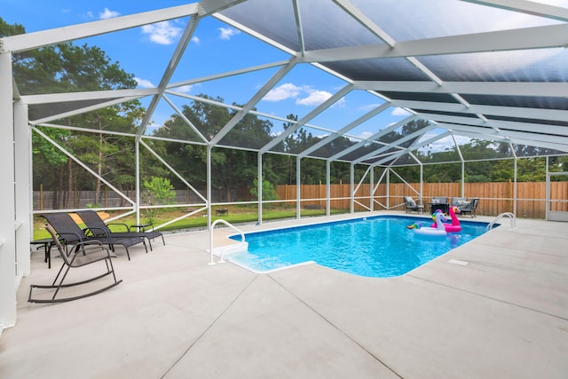 1922 Frontera St, Navarre, FL 32566 - view of swimming pool with a fenced backyard, a patio area, and glass enclosure