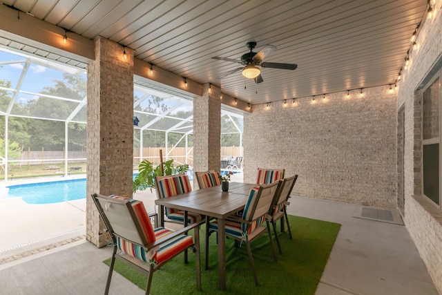 1922 Frontera St, Navarre, FL 32566 - fenced backyard with a patio area, a ceiling fan, and glass enclosure