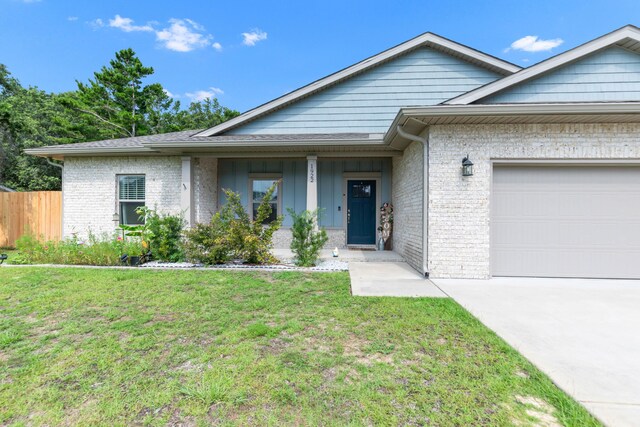 1922 Frontera St, Navarre, FL 32566 - single story home with a garage, brick siding, and concrete driveway