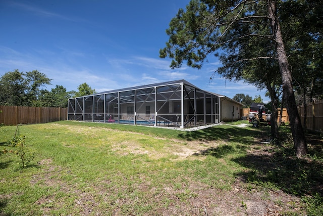 1922 Frontera St, Navarre, FL 32566 - fenced backyard featuring a pool and glass enclosure