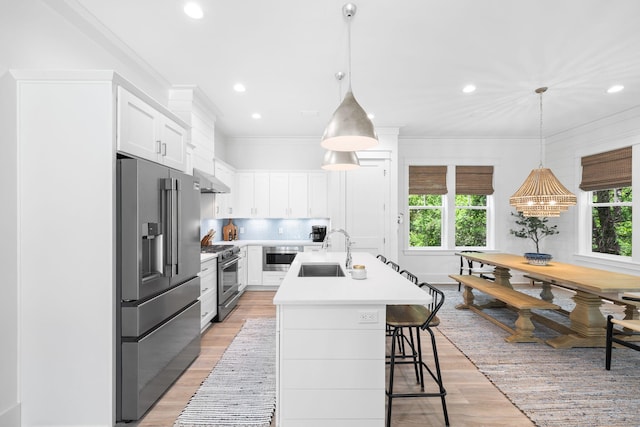 213 Spotted Dolphin Rd, Santa Rosa Beach, FL 32459 - kitchen with premium appliances, plenty of natural light, light wood finished floors, recessed lighting, and light countertops