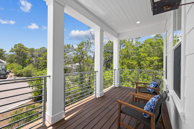 213 Spotted Dolphin Rd, Santa Rosa Beach, FL 32459 - wooden porch with view of scattered trees