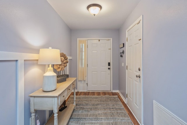 337 Peggy Dr, Crestview, FL 32536 - entryway with dark wood-style floors and baseboards