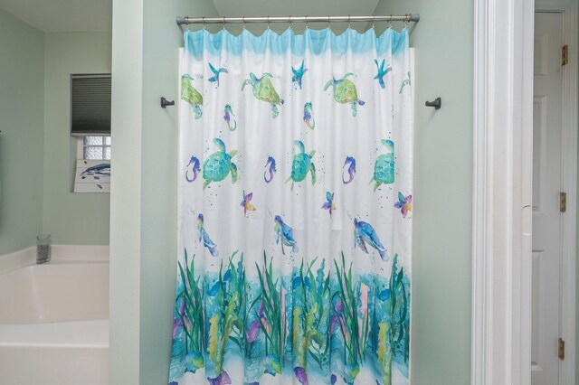 337 Peggy Dr, Crestview, FL 32536 - bathroom featuring a bath and a shower with curtain