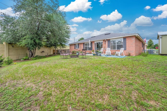 337 Peggy Dr, Crestview, FL 32536 - rear view of property with brick siding and a patio area