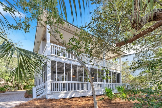 69 Lake Pointe Dr, Santa Rosa Beach, FL 32459 - back of property featuring a sunroom and a balcony