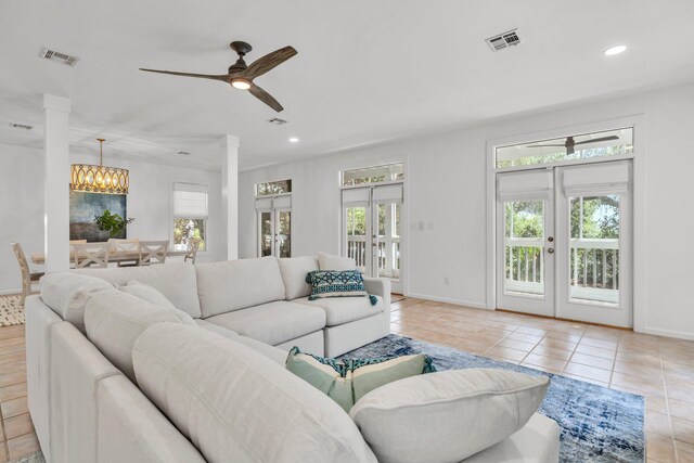 69 Lake Pointe Dr, Santa Rosa Beach, FL 32459 - living room with ornate columns, french doors, tile patterned floors, ceiling fan, and recessed lighting