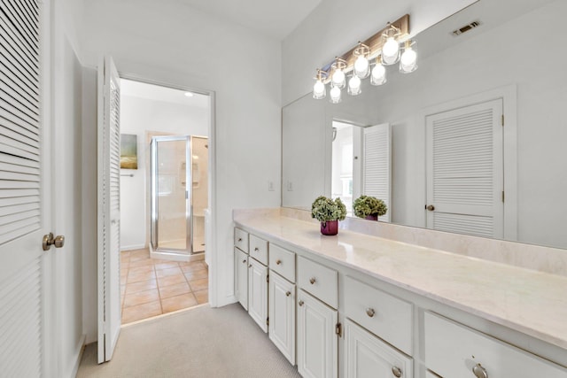 69 Lake Pointe Dr, Santa Rosa Beach, FL 32459 - bathroom with vanity, a shower stall, and tile patterned flooring