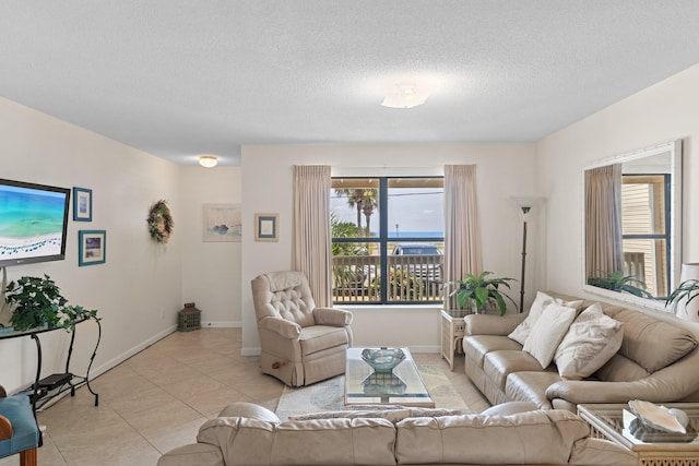 3705 E Old Highway 98 # 6, Destin, FL 32541 - living room featuring light tile patterned floors and a textured ceiling