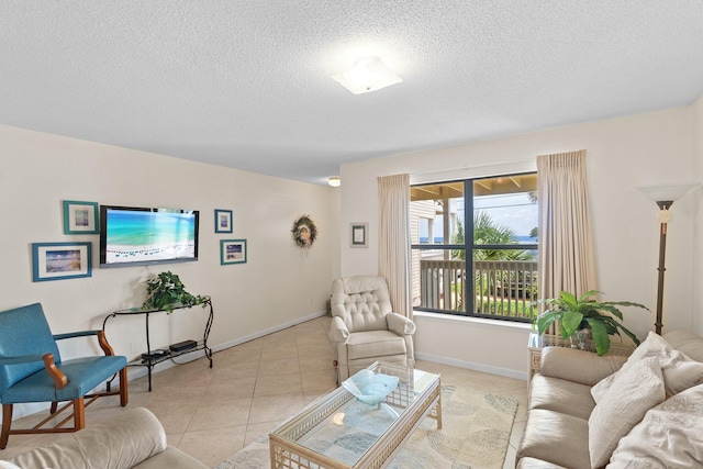 3705 E Old Highway 98 # 6, Destin, FL 32541 - living area featuring a textured ceiling and light tile patterned floors