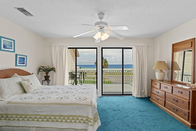 3705 E Old Highway 98 # 6, Destin, FL 32541 - bedroom with access to exterior, carpet, multiple windows, a textured ceiling, and a ceiling fan