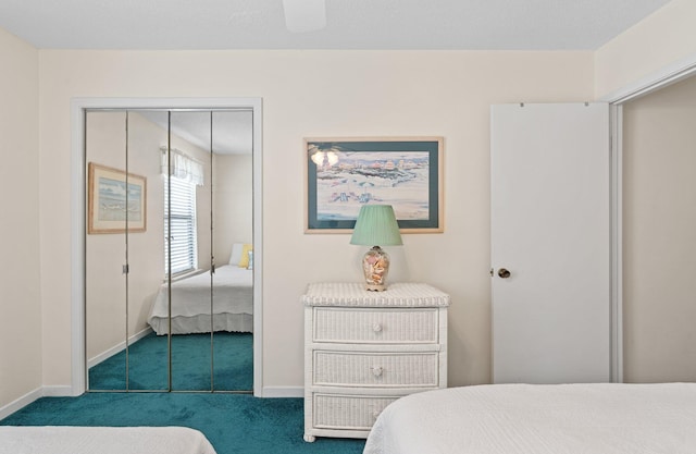3705 E Old Highway 98 # 6, Destin, FL 32541 - bedroom featuring dark carpet, a closet, and ceiling fan