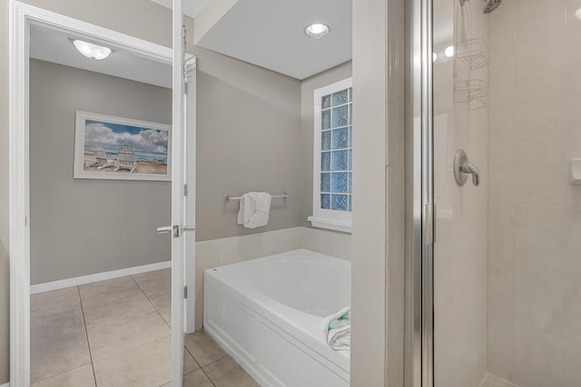 1517 SW Miracle Strip Pkwy Unit 309, Fort Walton Beach, FL 32548 - full bath with a stall shower, a garden tub, and tile patterned flooring