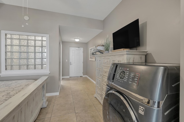 1517 SW Miracle Strip Pkwy Unit 309, Fort Walton Beach, FL 32548 - washroom featuring washer / dryer and light tile patterned floors