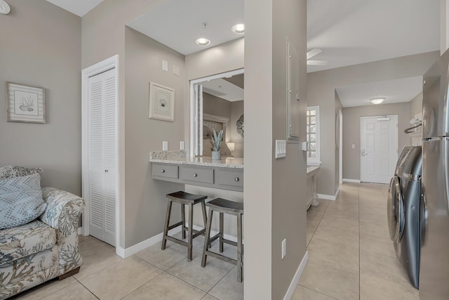 1517 SW Miracle Strip Pkwy Unit 309, Fort Walton Beach, FL 32548 - bathroom with a closet, tile patterned floors, washer / clothes dryer, and a ceiling fan