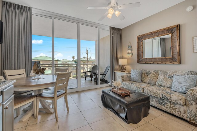 1517 SW Miracle Strip Pkwy Unit 309, Fort Walton Beach, FL 32548 - living room featuring expansive windows, a ceiling fan, and light tile patterned floors