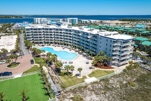 1517 SW Miracle Strip Pkwy Unit 309, Fort Walton Beach, FL 32548 - drone / aerial view of a pool area and a nearby body of water