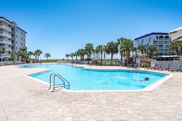1517 SW Miracle Strip Pkwy Unit 309, Fort Walton Beach, FL 32548 - community pool featuring a patio area