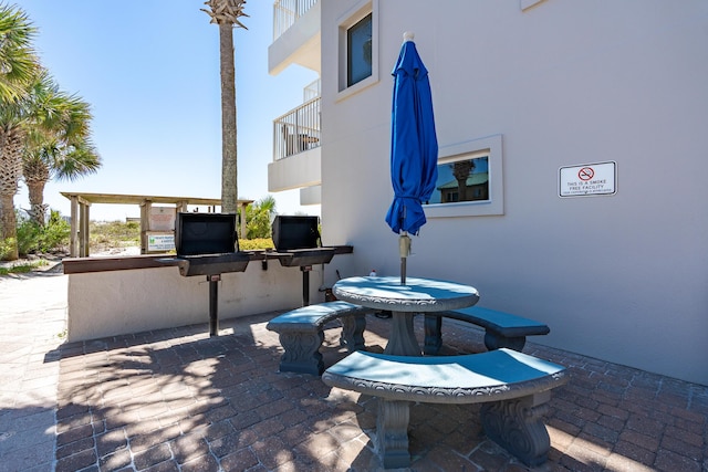 1517 SW Miracle Strip Pkwy Unit 309, Fort Walton Beach, FL 32548 - patio / terrace with a patio and an outdoor kitchen