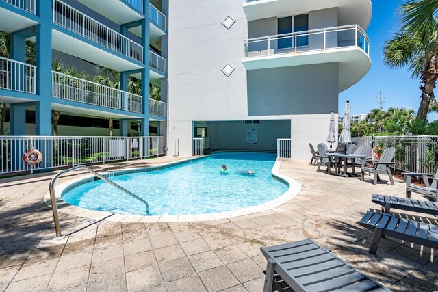 1517 SW Miracle Strip Pkwy Unit 309, Fort Walton Beach, FL 32548 - community pool with a patio