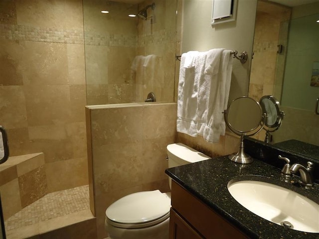 291 Scenic Gulf Dr Unit 1401, Miramar Beach, FL 32550 - bathroom with a walk in shower, vanity, and tile walls