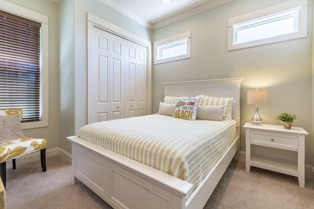 192 E Blue Crab Loop, Inlet Beach, FL 32461 - bedroom with light colored carpet, ornamental molding, and a closet