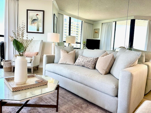 1096 Scenic Gulf Dr Unit 1512, Miramar Beach, FL 32550 - living area featuring a wall of windows, ornamental molding, a textured ceiling, and wood finished floors