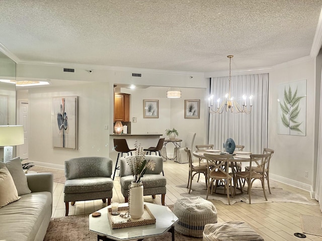 1096 Scenic Gulf Dr Unit 1512, Miramar Beach, FL 32550 - living area with ornamental molding, light wood-style floors, a chandelier, and a textured ceiling