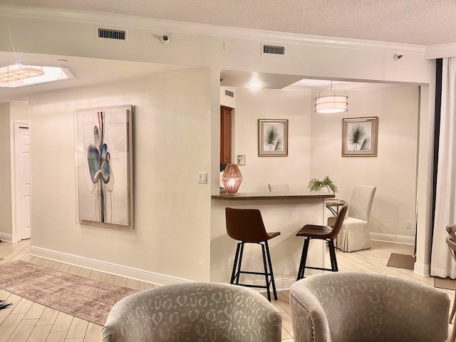 1096 Scenic Gulf Dr Unit 1512, Miramar Beach, FL 32550 - bar area featuring light wood-style flooring and ornamental molding