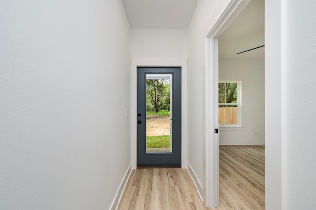 2940 Mccarty Ave, Crestview, FL 32539 - doorway with light wood-style flooring and baseboards