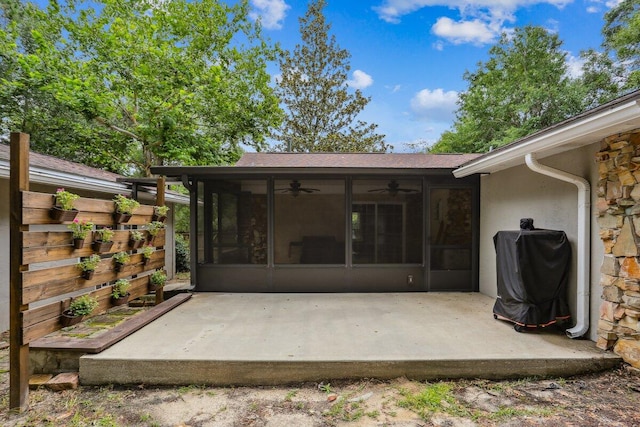 107 Shell Dr, Crestview, FL 32536 - back of house with a ceiling fan, a sunroom, a patio area, and stucco siding