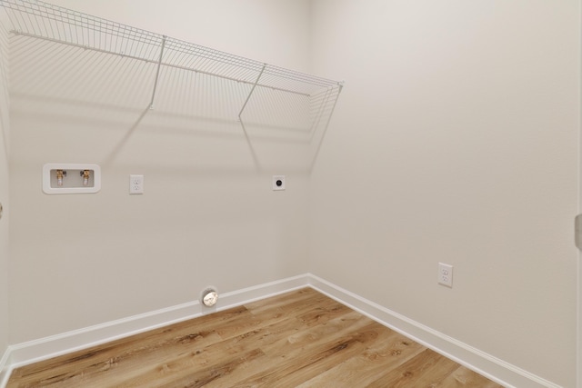6109 Tansey St, Crestview, FL 32539 - laundry room featuring light wood-style floors, hookup for a washing machine, and electric dryer hookup