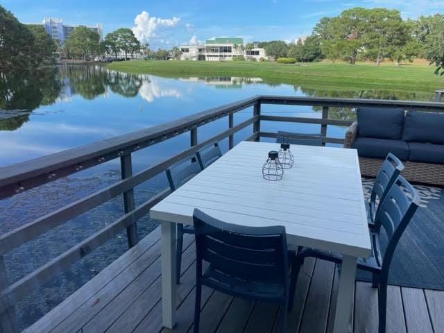 431 Linkside Cir, Miramar Beach, FL 32550 - dock area featuring a water view and an outdoor hangout area
