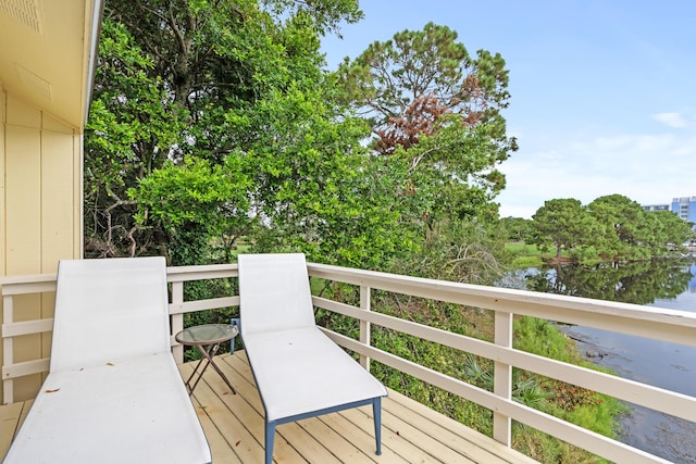 431 Linkside Cir, Miramar Beach, FL 32550 - wooden terrace with a water view