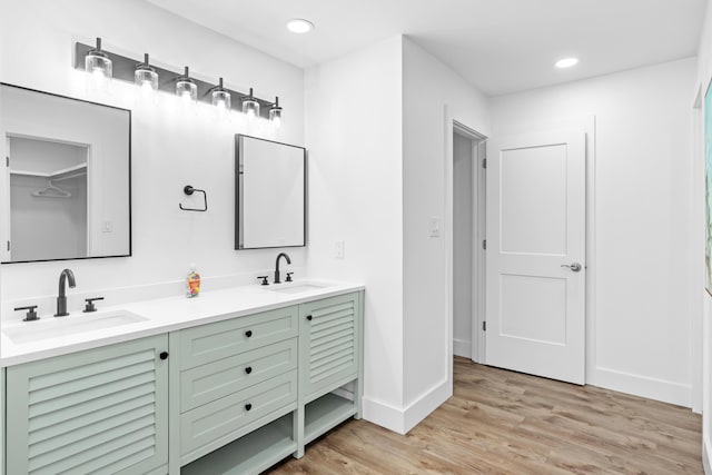 431 Linkside Cir, Miramar Beach, FL 32550 - full bathroom featuring double vanity, wood finished floors, and recessed lighting