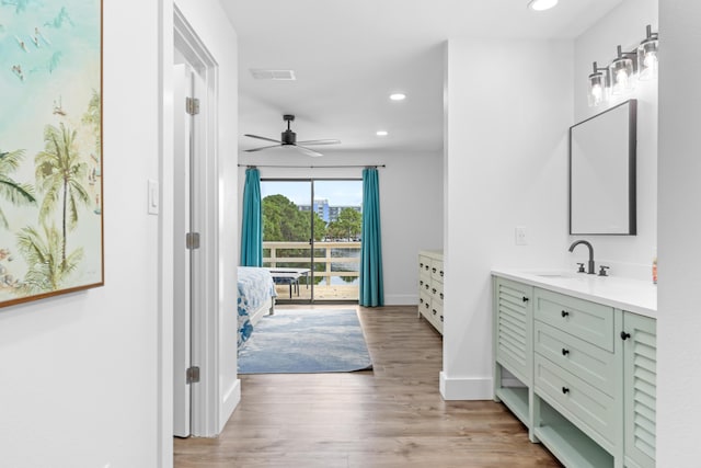 431 Linkside Cir, Miramar Beach, FL 32550 - bathroom featuring vanity, wood finished floors, recessed lighting, ceiling fan, and connected bathroom