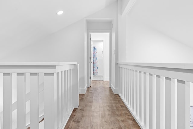 431 Linkside Cir, Miramar Beach, FL 32550 - hall featuring vaulted ceiling, wood finished floors, and recessed lighting