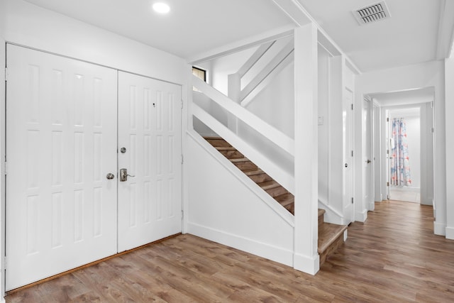 431 Linkside Cir, Miramar Beach, FL 32550 - foyer entrance featuring stairway, wood finished floors, and recessed lighting