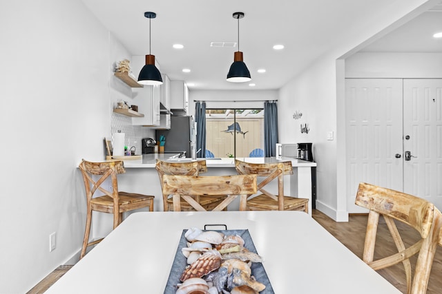 431 Linkside Cir, Miramar Beach, FL 32550 - dining room with recessed lighting and wood finished floors