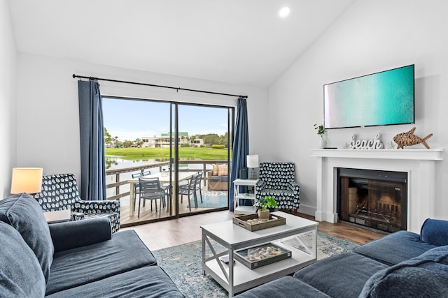 431 Linkside Cir, Miramar Beach, FL 32550 - living area featuring vaulted ceiling, a fireplace, wood finished floors, and recessed lighting
