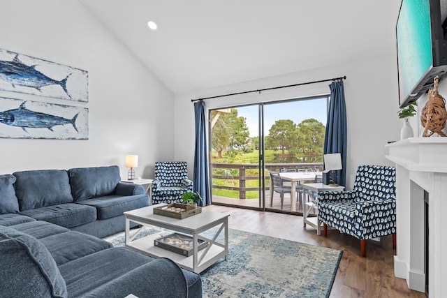 431 Linkside Cir, Miramar Beach, FL 32550 - living room featuring wood finished floors, recessed lighting, a fireplace, and high vaulted ceiling
