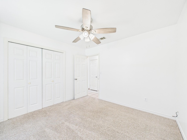 422 John King Rd, Crestview, FL 32539 - unfurnished bedroom with light colored carpet, a closet, and a ceiling fan