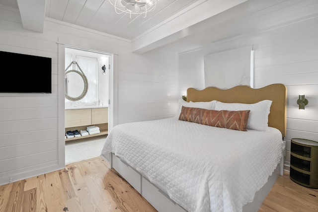 54 Roberts Way, Santa Rosa Beach, FL 32459 - bedroom featuring wood finished floors, wooden walls, and ensuite bathroom