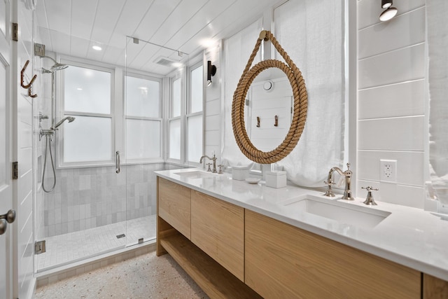 54 Roberts Way, Santa Rosa Beach, FL 32459 - bathroom featuring double vanity, a stall shower, and speckle patterned floor